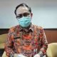 Kepala Disperindagkop Kaltim HM Yadi Robyan Noor saat diwawancarai awak media. (Devi Nila Sari/Akurasi.id)